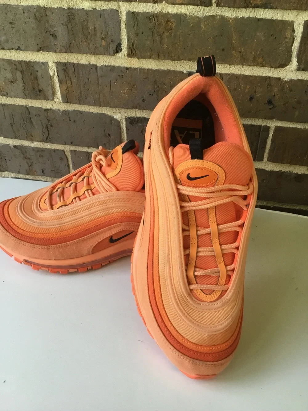 Nike Women’s Air Max 97 in Orange and Coral
